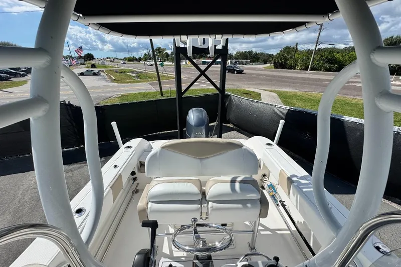 Slide: The Image of 2017 Robalo R200 Center Console boat interior with seating and steering wheel. - 35