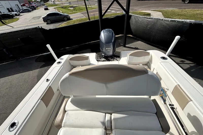 Slide: The Image of 2017 Robalo R200 Center Console boat with Yamaha 150 engine, parked outdoors. - 36