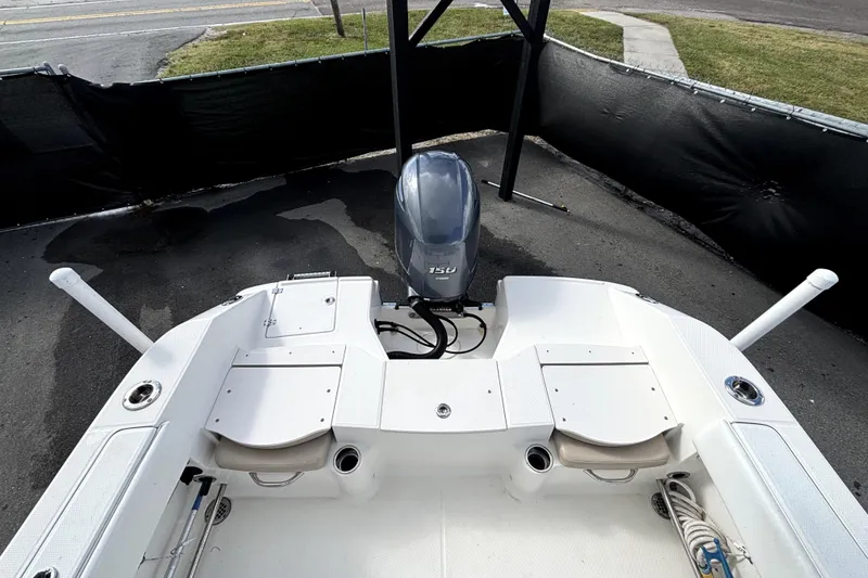 Slide: The Image of 2017 Robalo R200 Center Console boat with Yamaha 150 engine, docked on pavement. - 38