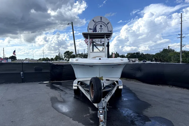 Slide: The Image of 2017 Robalo R200 Center Console boat on trailer under cloudy sky. - 4