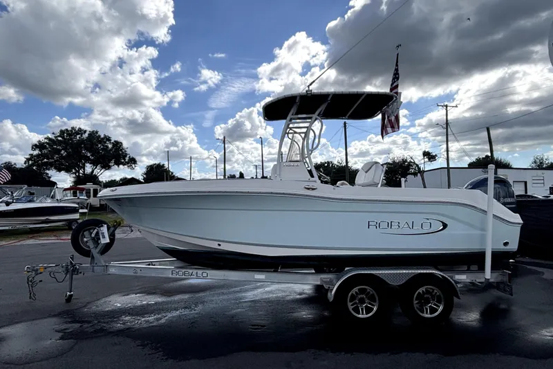 Slide: The Image of 2017 Robalo R200 Center Console boat on trailer under cloudy sky. - 6