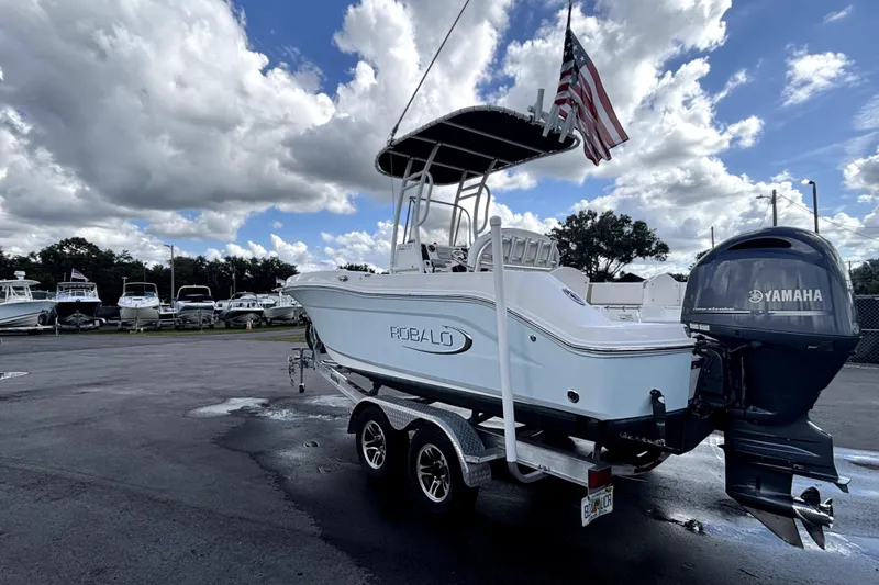 Slide: The Image of 2017 Robalo R200 Center Console boat with Yamaha engine on trailer, under cloudy sky. - 7