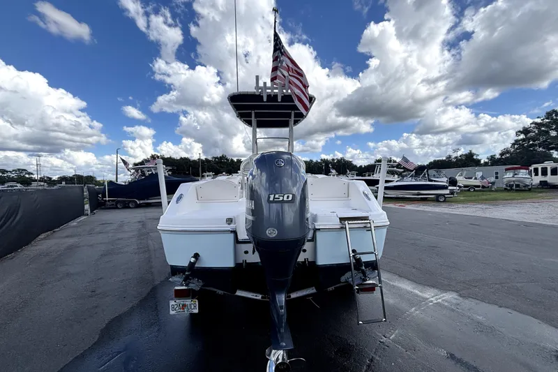 Slide: The Image of 2017 Robalo R200 Center Console boat with Yamaha 150 engine, parked outdoors. - 8