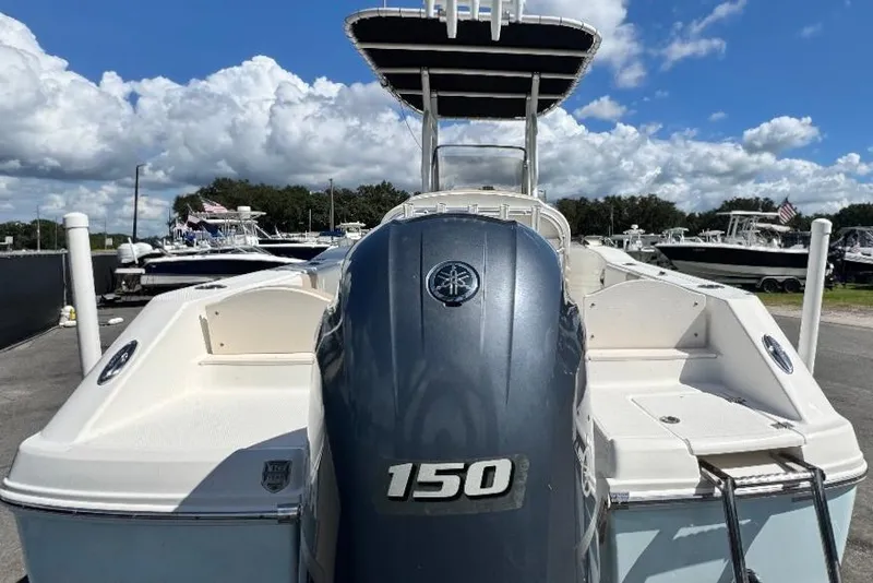 Slide: The Image of 2017 Robalo R200 Center Console boat with Yamaha 150 engine, docked under blue sky. - 9