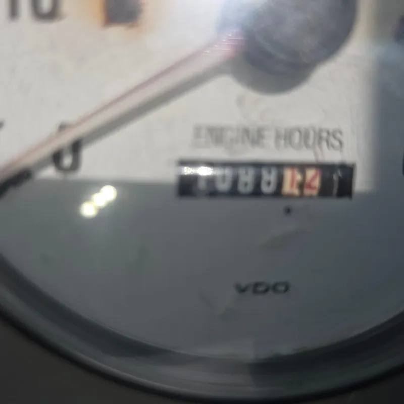 Slide: The Image of Close-up of a 1998 Formula 33 Super Sun Sport engine hour meter. - 24