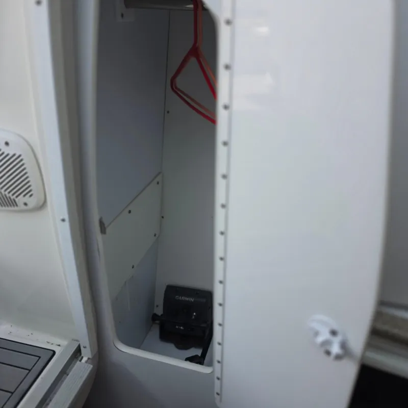 Slide: The Image of Open storage compartment in 1998 Formula 33 Super Sun Sport boat. - 25