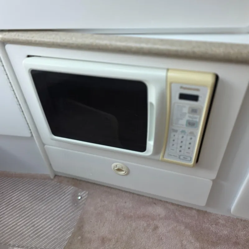 Slide: The Image of Built-in microwave in 1998 Formula 33 Super Sun Sport boat interior. - 29