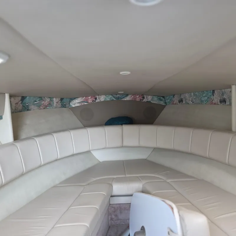 Slide: The Image of Interior of a 1998 Formula 33 Super Sun Sport boat with beige seating. - 30