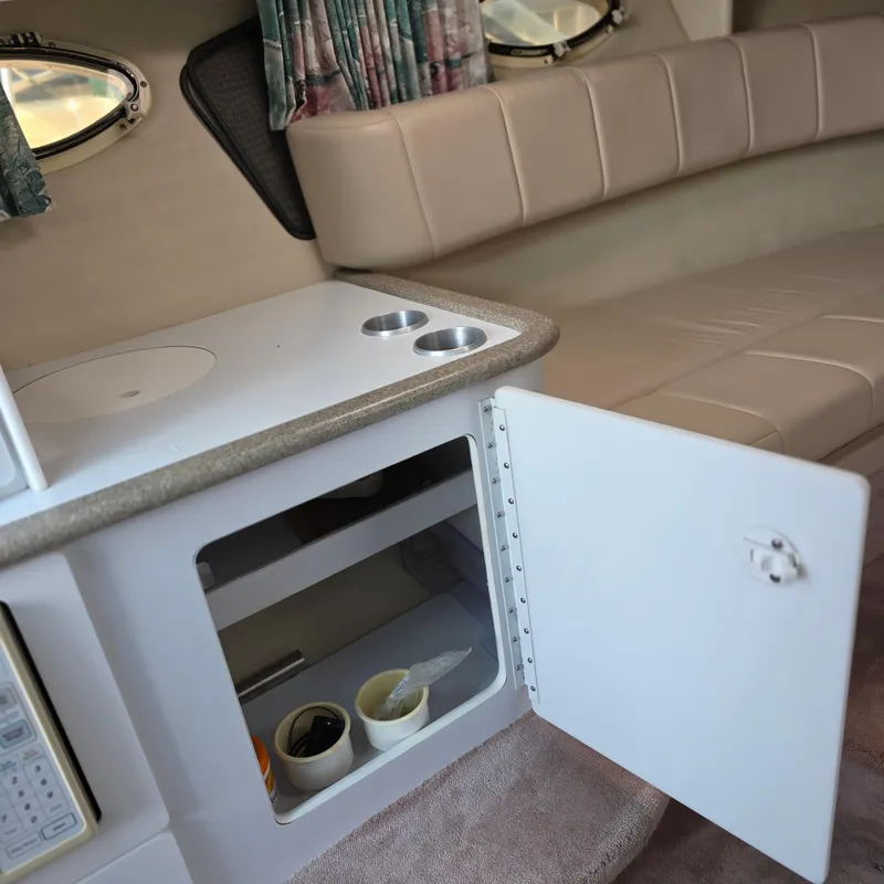 Slide: The Image of 1998 Formula 33 Super Sun Sport cabin interior with open storage and seating. - 35