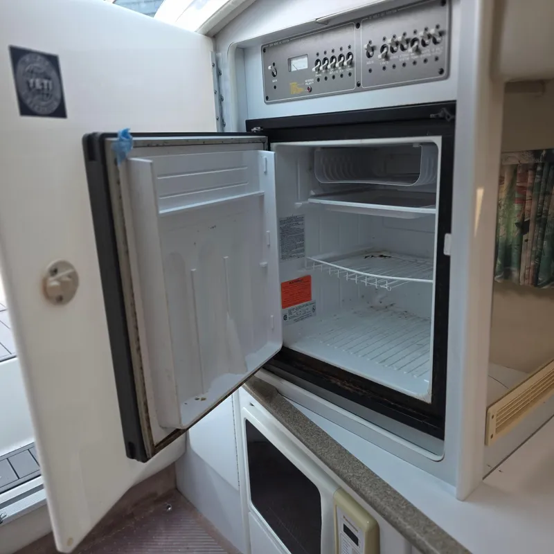 Slide: The Image of Open refrigerator in 1998 Formula 33 Super Sun Sport boat interior. - 39