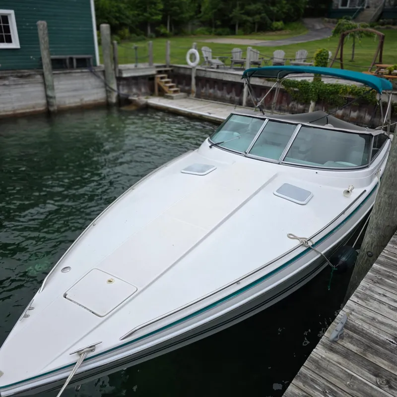 Slide: The Image of 1998 Formula 33 Super Sun Sport boat docked at a marina. - 4