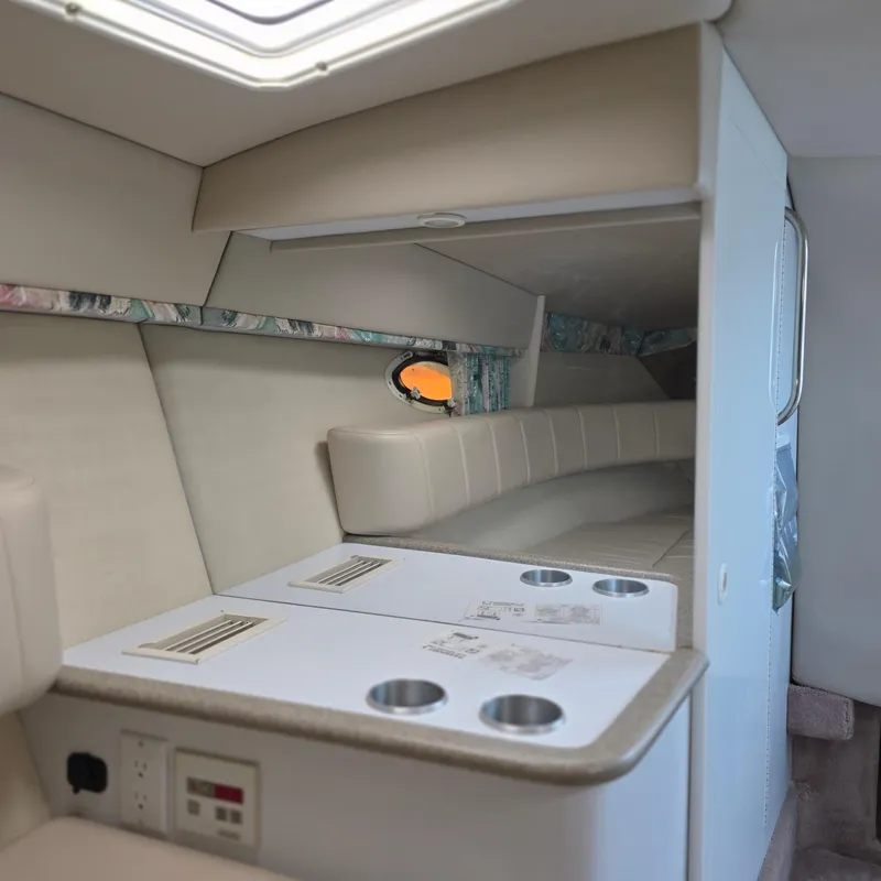 Slide: The Image of Interior of 1998 Formula 33 Super Sun Sport boat with seating and cup holders. - 41