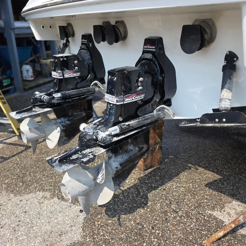 Slide: The Image of 1998 Formula 33 Super Sun Sport boat with dual MerCruiser outdrives on a trailer. - 43