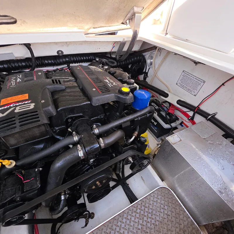 Slide: The Image of Engine compartment of a 1998 Formula 33 Super Sun Sport boat, featuring a MerCruiser V8 engine. - 45
