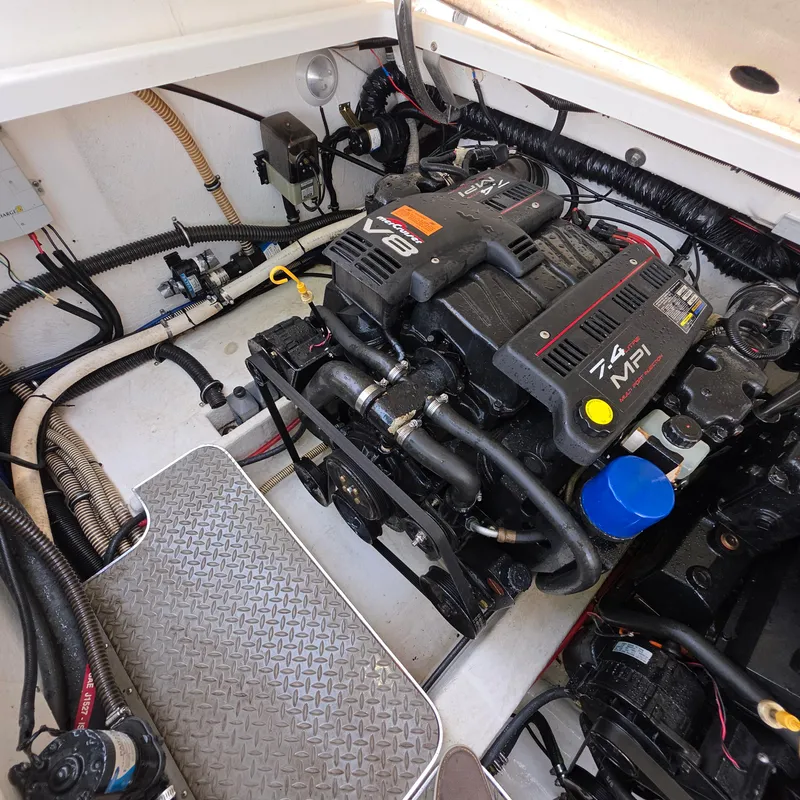 Slide: The Image of Engine compartment of a 1998 Formula 33 Super Sun Sport boat, featuring a V8 7.4 MPI engine. - 46