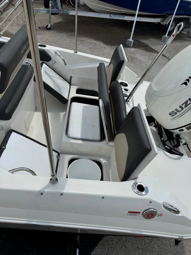 Slide: The Image of 2019 Stingray 186 CC boat interior with seating and storage compartments. - 15