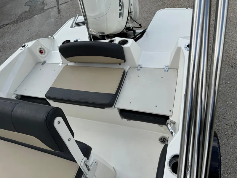 Slide: The Image of 2019 Stingray 186 CC boat interior with seating and motor, featuring sleek design elements. - 24