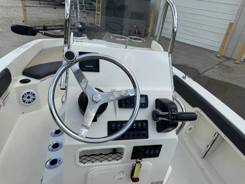 Slide: The Image of 2019 Stingray 186 CC boat console with steering wheel and controls. - 28