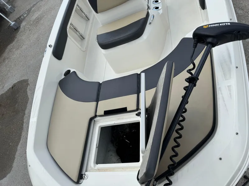 Slide: The Image of 2019 Stingray 186 CC boat interior with Minn Kota trolling motor and storage compartment. - 33