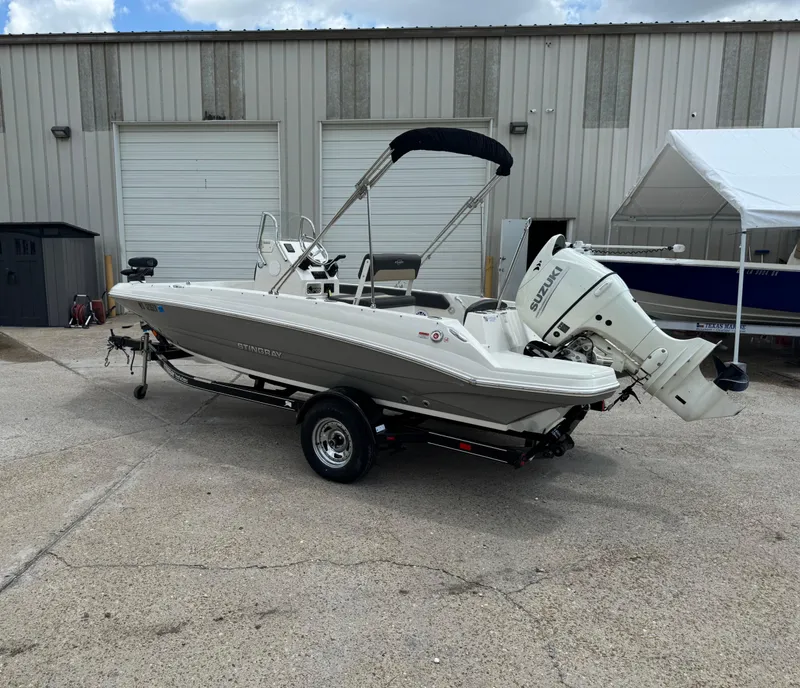 Slide: The Image of 2019 Stingray 186 CC boat with Suzuki outboard motor on trailer. - 39