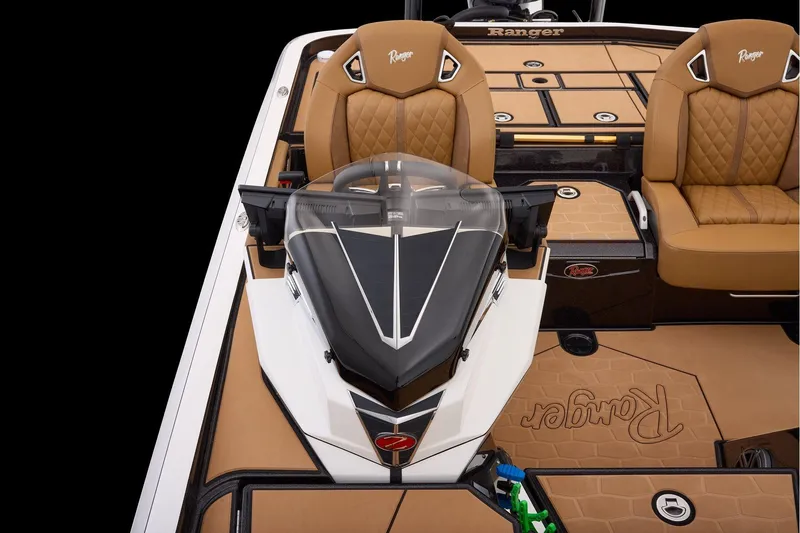 Slide: The Image of 2026 Ranger Z521R Ultra boat interior with tan seats and sleek design. - 12