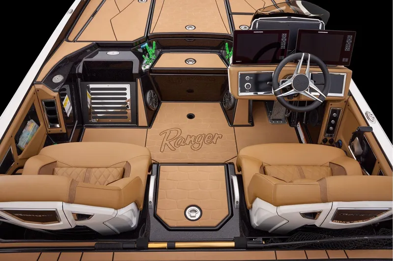 Slide: The Image of 2026 Ranger Z521R Ultra boat interior with tan leather seats and modern dashboard. - 14
