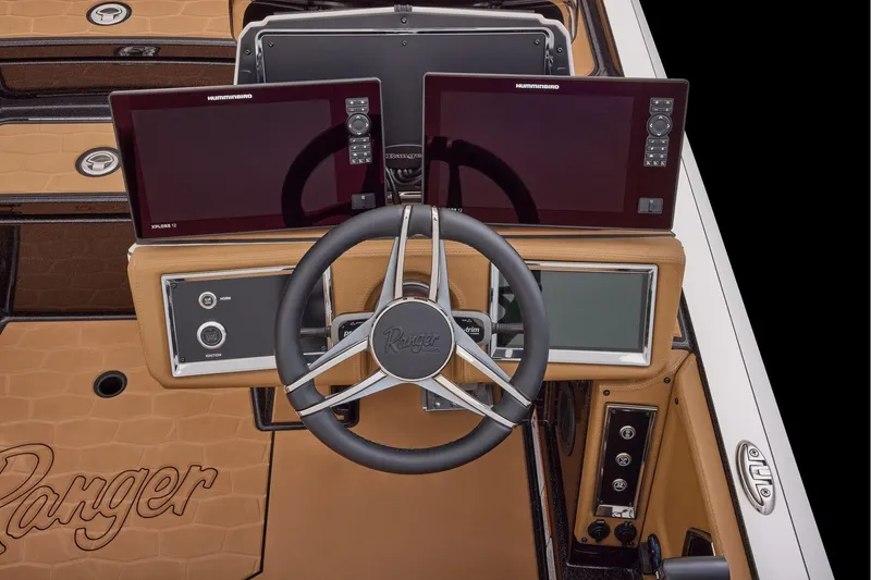 Slide: The Image of 2026 Ranger Z521R Ultra boat dashboard with dual Humminbird displays and steering wheel. - 16