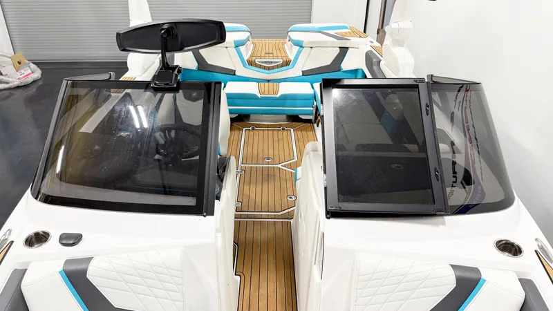 Slide: The Image of 2022 Nautique G23 boat interior with modern design and seating. - 10