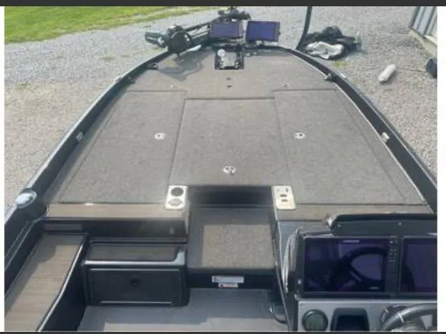Slide: The Image of 2022 Triton 21 XrT boat interior with control panels and storage compartments. - 6