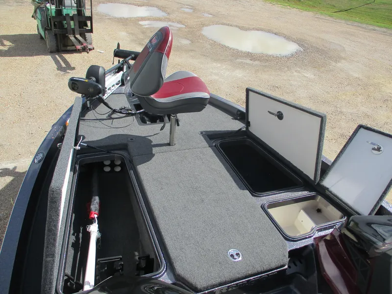 Slide: The Image of 2019 Ranger Z519L boat deck with storage compartments and a red seat. - 10