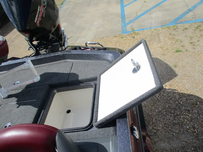 Slide: The Image of 2019 Ranger Z519L boat with open storage compartment and Mercury Pro XS engine. - 12