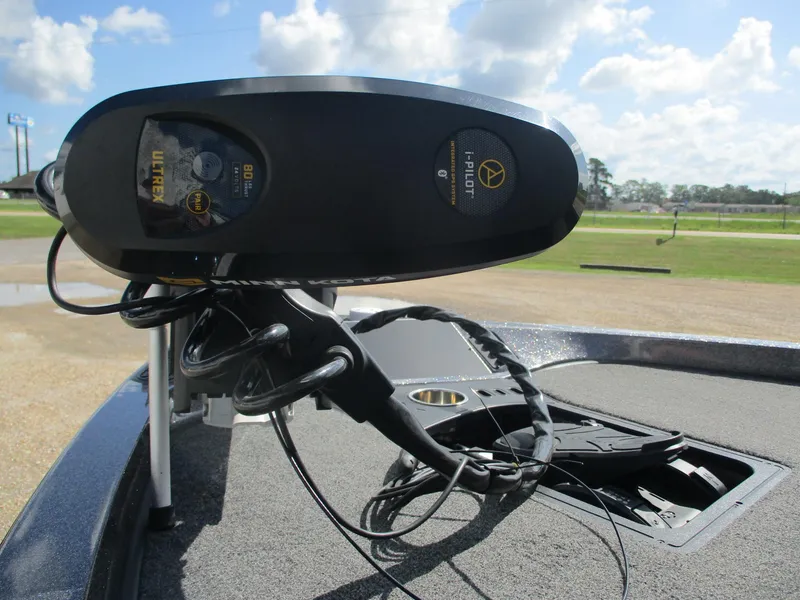 Slide: The Image of 2019 Ranger Z519L boat with Minn Kota Ultrex trolling motor under a clear sky. - 13