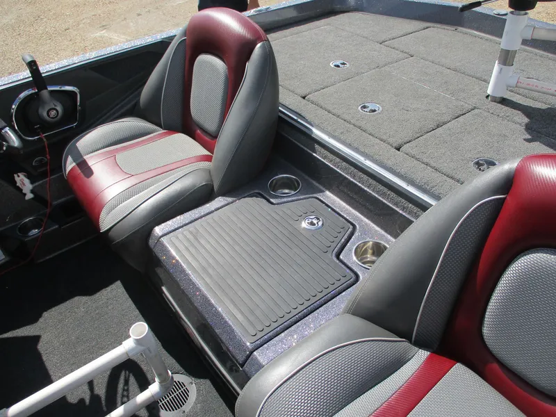 Slide: The Image of 2019 Ranger Z519L boat interior with red and gray seats, carpeted deck, and steering wheel. - 14