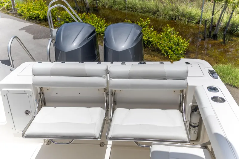 Slide: The Image of Edgewater 280 CX 2015 boat with dual outboard engines and comfortable seating. - 12