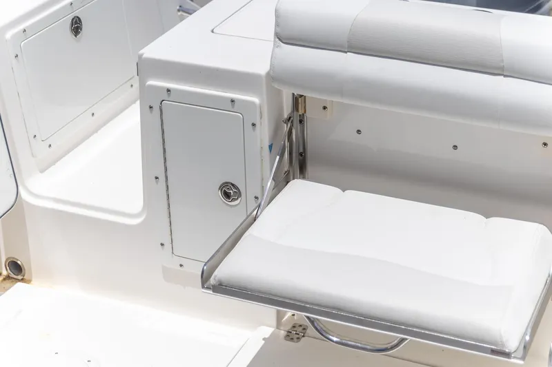 Slide: The Image of White seating area on a 2015 Edgewater 280 CX boat. - 13