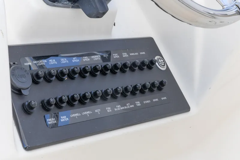 Slide: The Image of Control panel of a 2015 Edgewater 280 CX boat with labeled switches and USB port. - 20