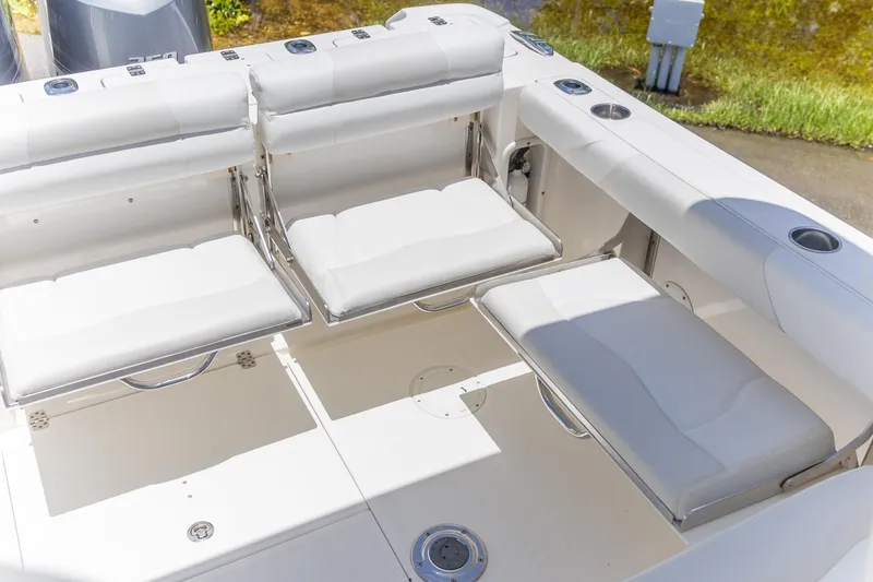 Slide: The Image of 2015 Edgewater 280 CX cabin interior with sink and cushioned seating. - 4