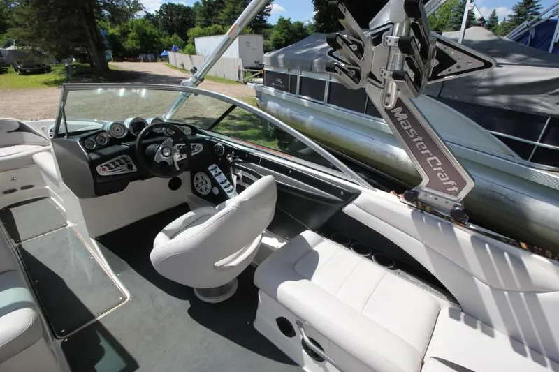 Slide: The Image of 2008 MasterCraft X-15 SS boat interior with steering wheel and seating. - 10
