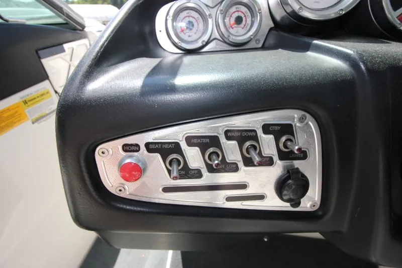 Slide: The Image of Control panel of 2008 MasterCraft X-15 SS boat with switches and gauges. - 12