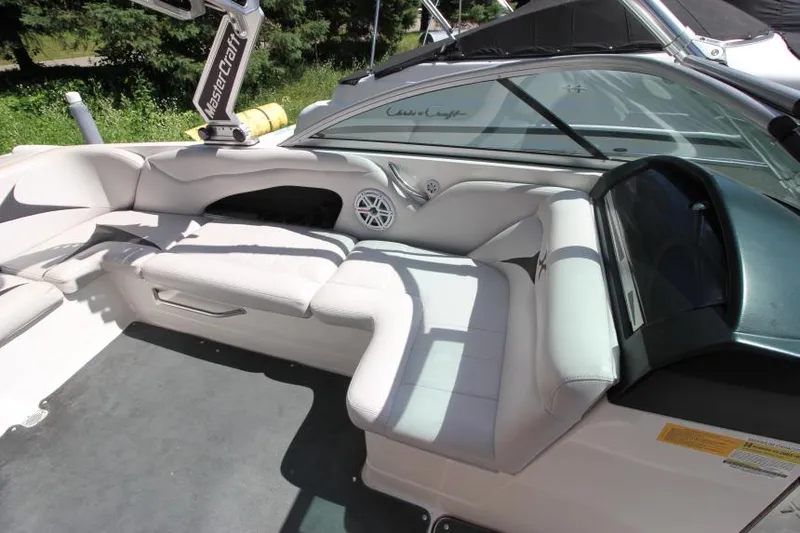 Slide: The Image of 2008 MasterCraft X-15 SS boat interior with white seating and speaker system. - 13