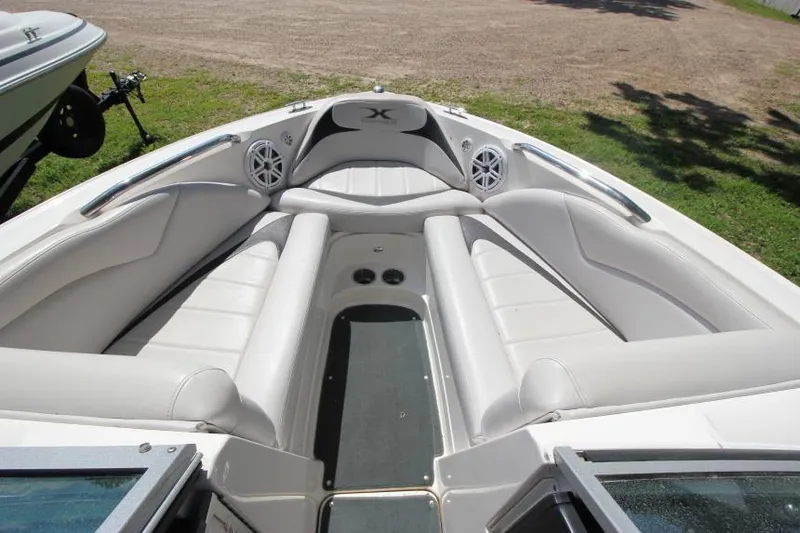 Slide: The Image of 2008 MasterCraft X-15 SS boat interior with white seating and speakers. - 18