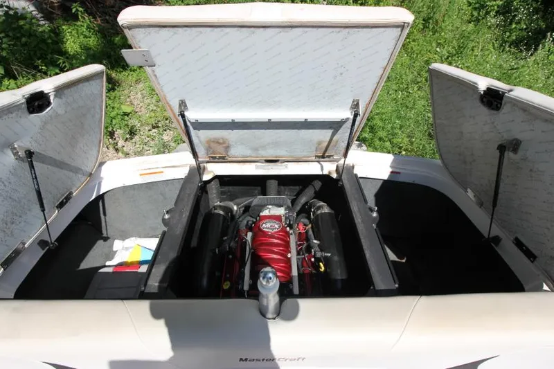 Slide: The Image of 2008 MasterCraft X-15 SS boat engine compartment with open hatches. - 21