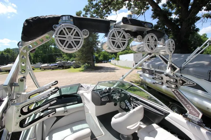Slide: The Image of 2008 MasterCraft X-15 SS boat interior with speakers and wakeboard racks. - 7