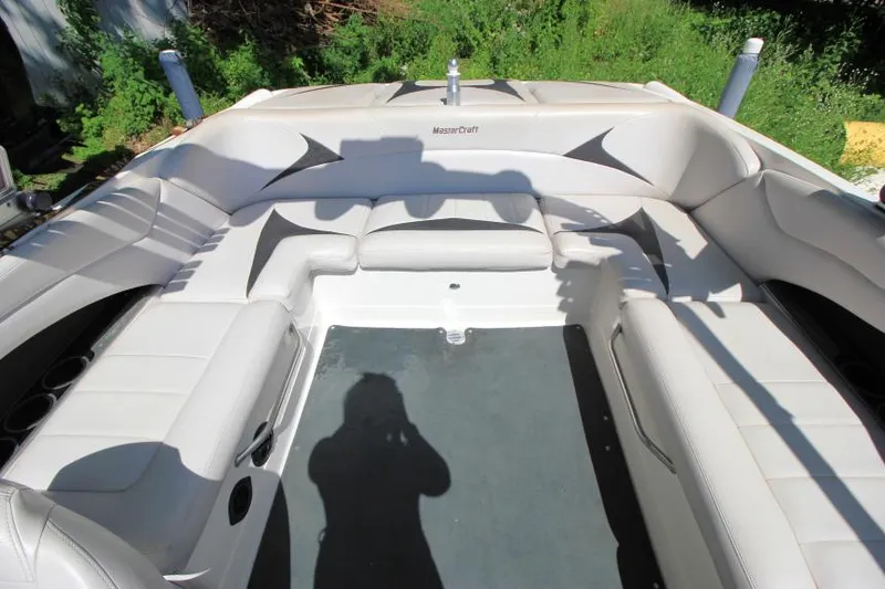 Slide: The Image of 2008 MasterCraft X-15 SS boat interior with white seating and spacious layout. - 8