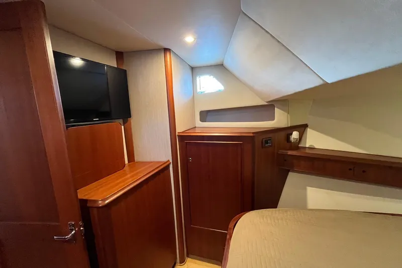 Slide: The Image of Luxurious cabin interior of 2015 Huckins 45 yacht with wood finishes and TV. - 17