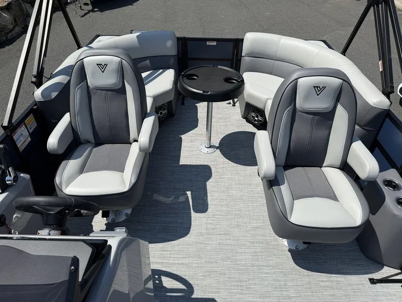 Slide: The Image of Interior of 2026 Viaggio V18U boat with gray seating and round table. - 12
