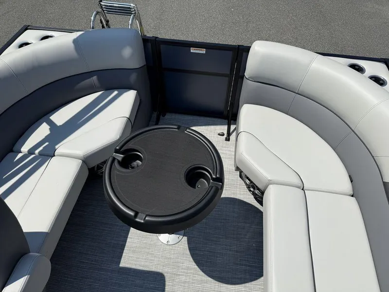 Slide: The Image of Luxurious seating area on 2026 Viaggio V18U boat with round table and cup holders. - 13