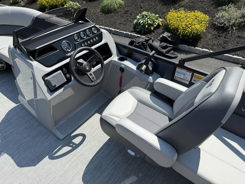 Slide: The Image of Interior of 2026 Viaggio V18U boat with steering wheel and captain's chair. - 14