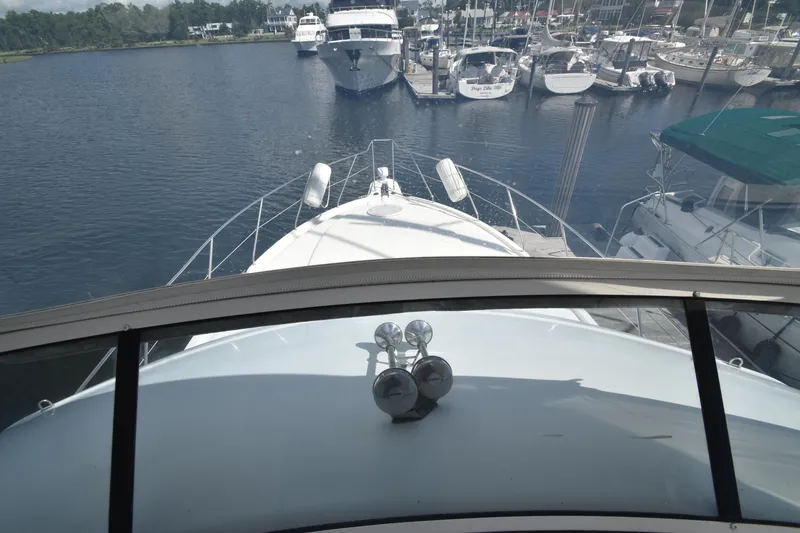 Slide: The Image of 2007 Silverton 38 Convertible yacht docked at marina, view from helm. - 12