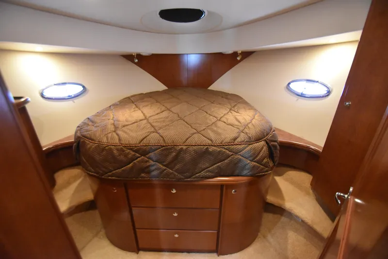 Slide: The Image of Luxurious cabin interior of 2007 Silverton 38 Convertible yacht with cozy bed and wood finish. - 17